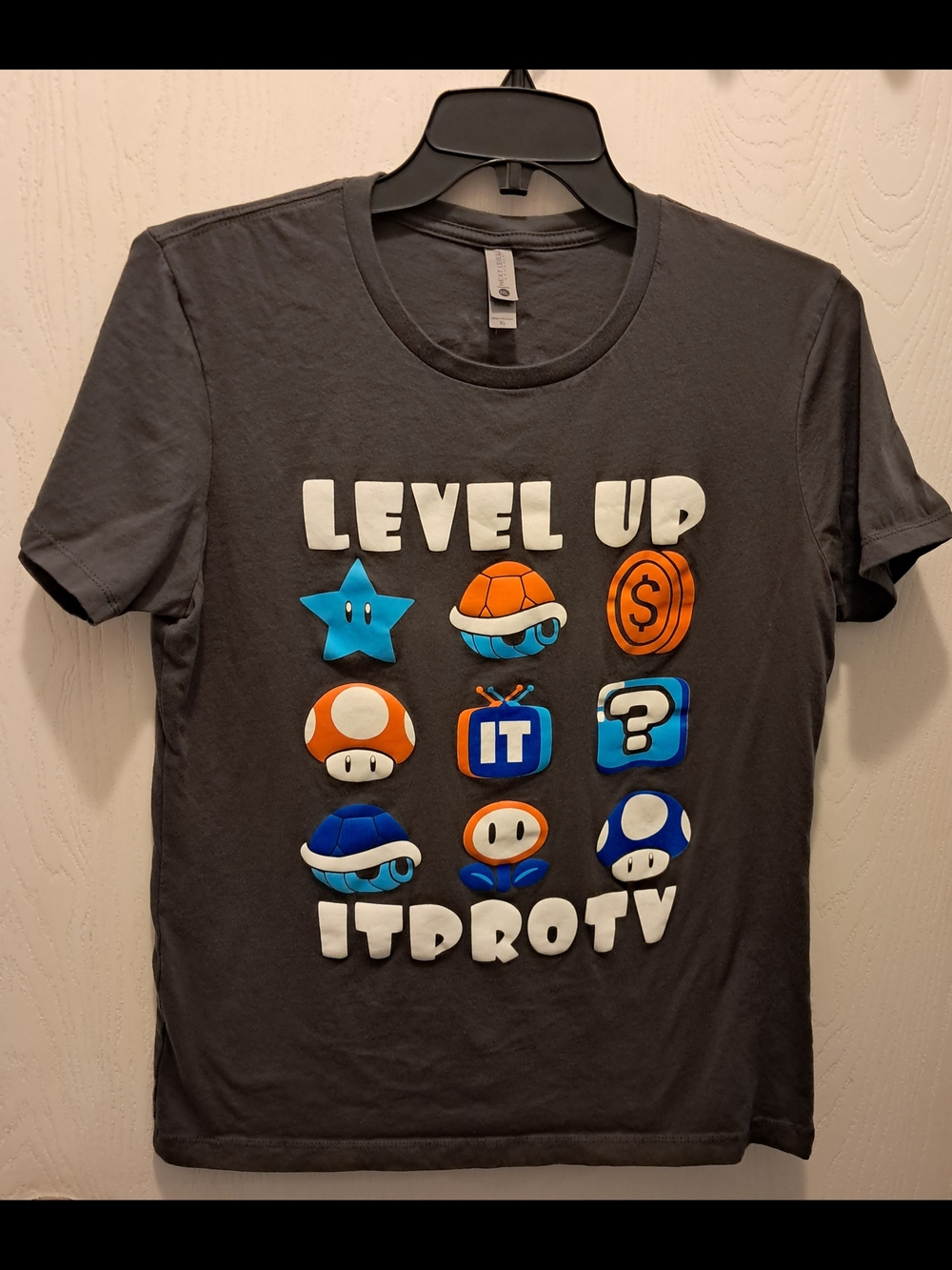 Next Level Apparel Kids Charcoal 'Level Up' Graphic Tee with Blue & Orange Icons